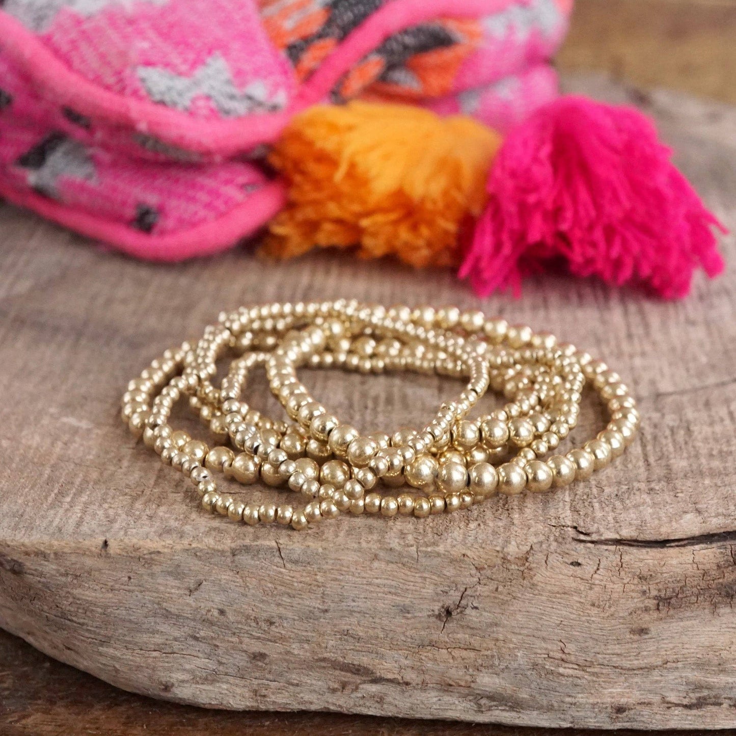 Multi size beaded bracelet stack 6 bracelets- worn gold tone