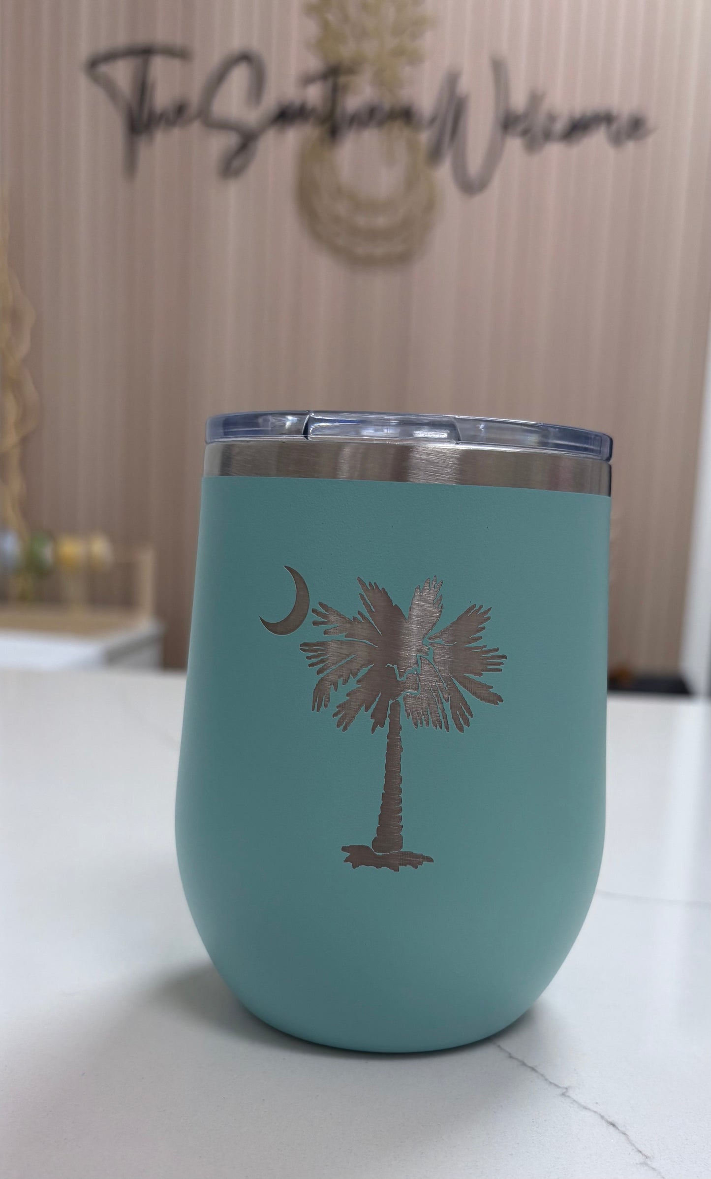 Locally made in Charleston Locally sourced in Charleston Blue tumbler with Palm Tree on a light background