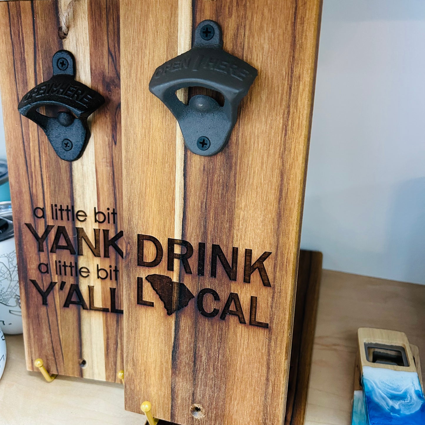 Pop bottles with style! This locally crafted wooden wall bottle opener combines function and charm, making it a perfect addition to your home bar or kitchen. Locally made in Charleston, SC. 