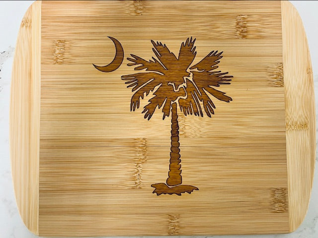 Locally sourced in Charleston. Beautifully engraved bamboo cutting board. Featuring iconic Charleston-inspired designs. Durable, eco-friendly.