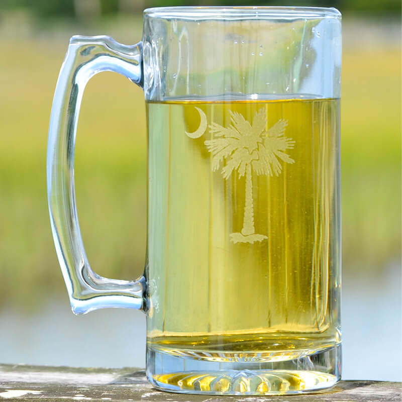 Locally sourced in Charleston, SC. These 27oz glass beer mugs are engraved the South Carolina palm and moon. 