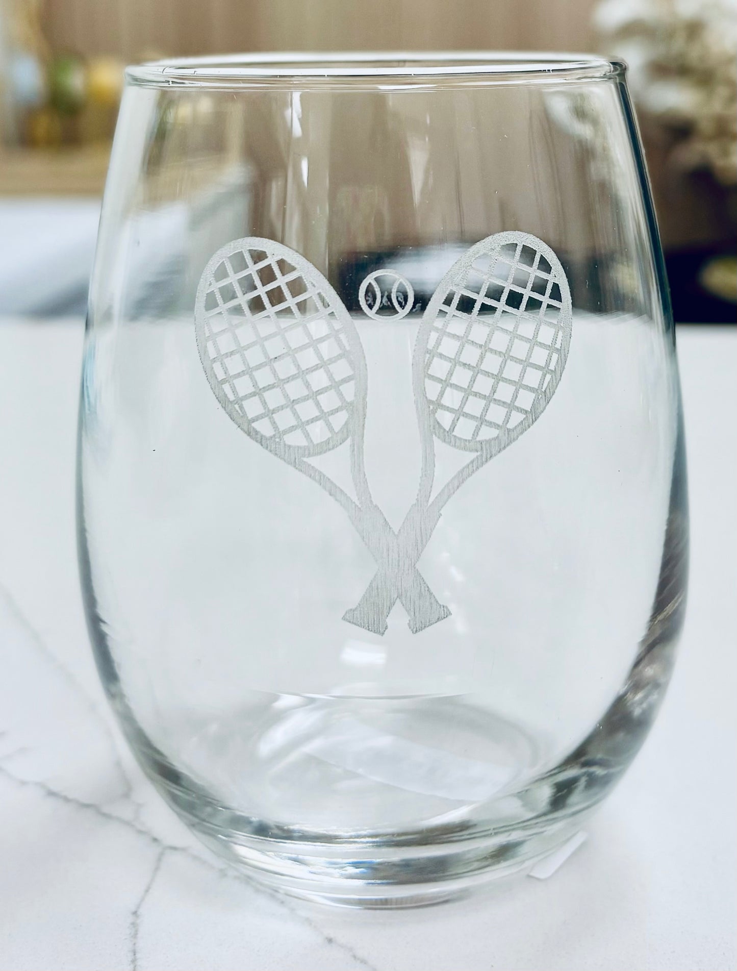 Locally made in Charleston Clear glass with tennis racket design on a white surface