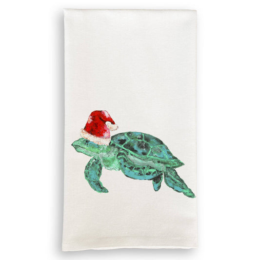 Towel with a green turtle wearing a red Santa hat on a white background