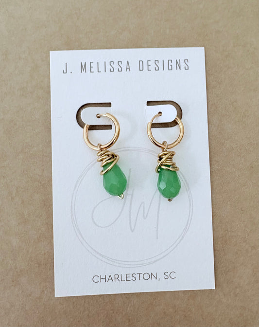 Gold earrings with green beads on a J. Melissa Designs card. ~ local Charleston jewelry