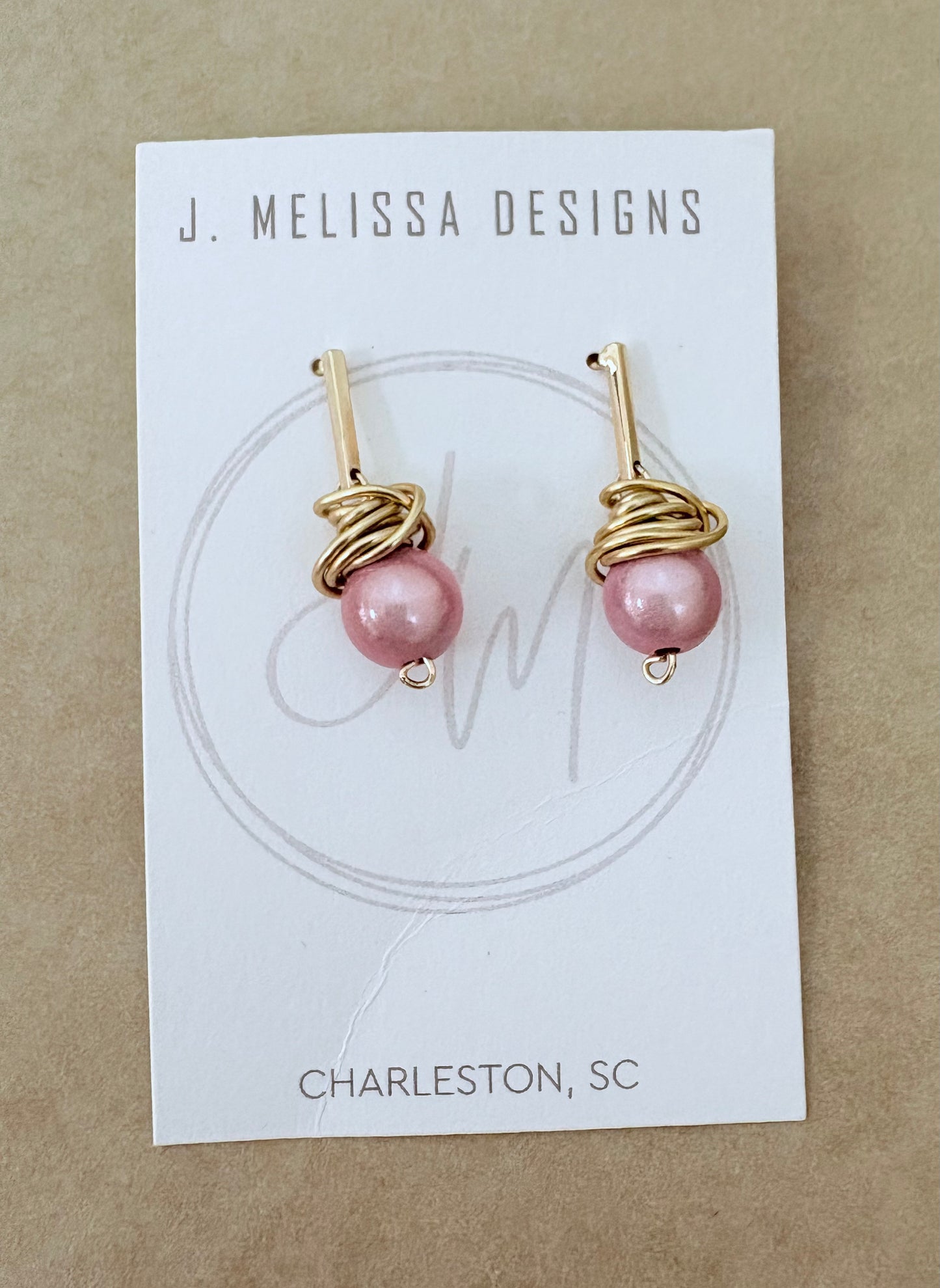 Pair of pink pearl earrings on a J. Melissa Designs card with 'Charleston, SC' text. ~ local Charleston jewelry