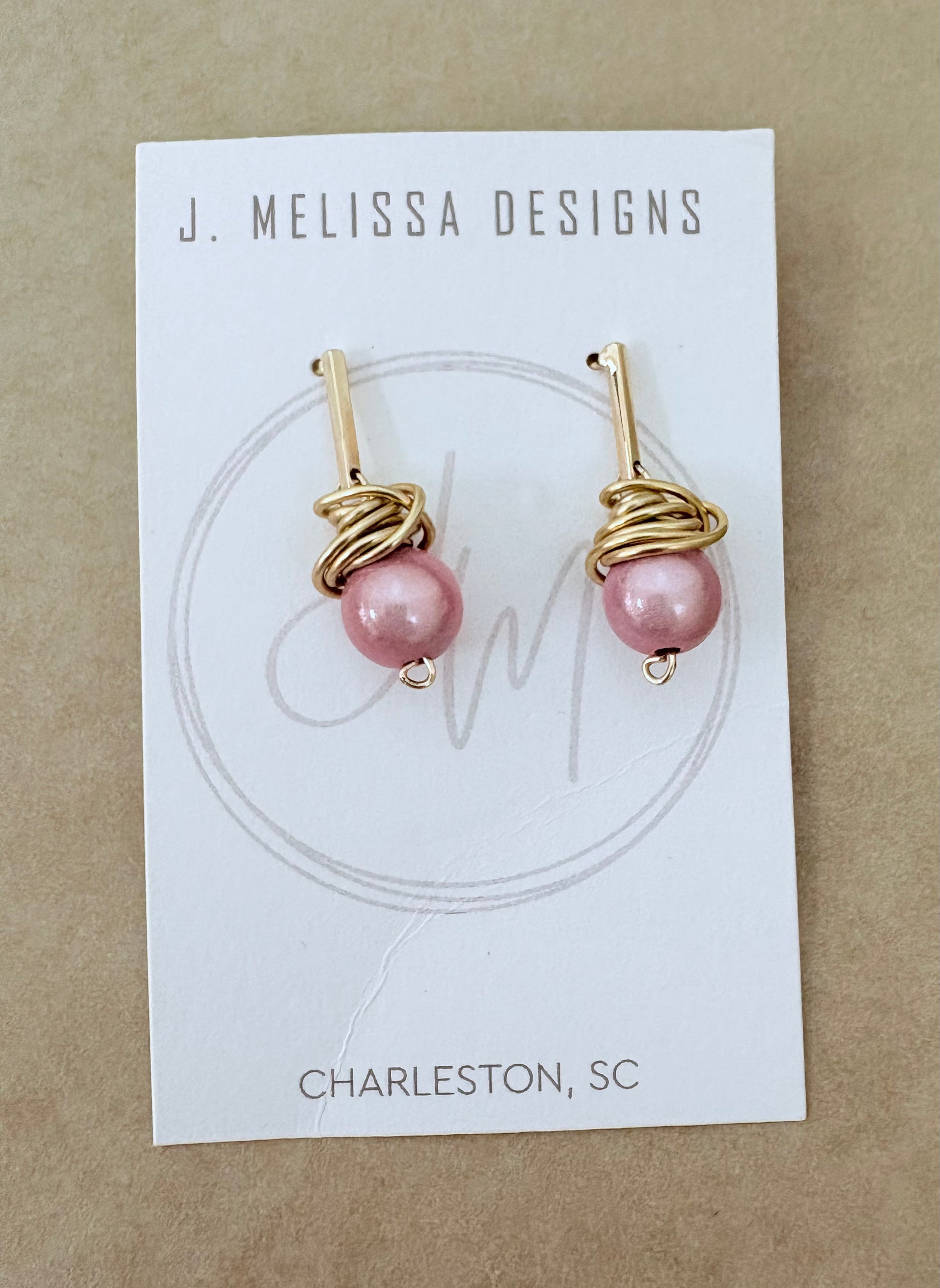 Pair of pink pearl earrings on a J. Melissa Designs card with 'Charleston, SC' text. ~ local Charleston jewelry