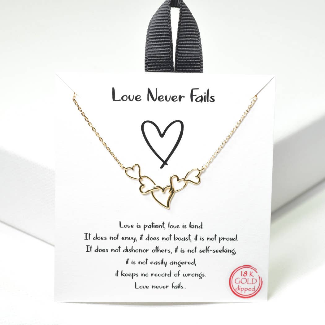 Love Never Fails dainty heart necklace